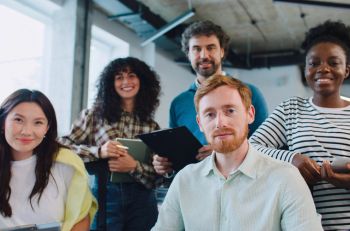 Group of small business employees in Grand Rapids, MI with group benefits