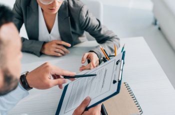 An agent in Grand Rapids going over an individual insurance plan with a client