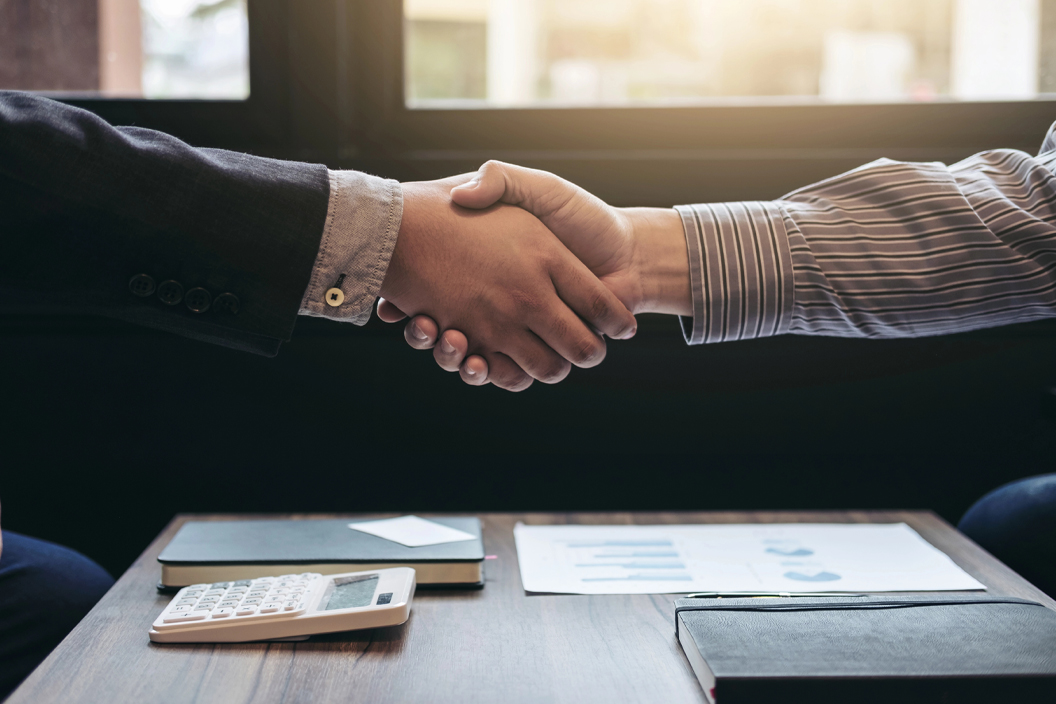 Group Benefits and Group Health Insurance Agency in Cadillac, MI Shaking Hands After Making a Deal