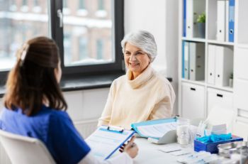 Elderly woman discussing a Medicare Advantage Plan with an agent in Grand Rapids, MI
